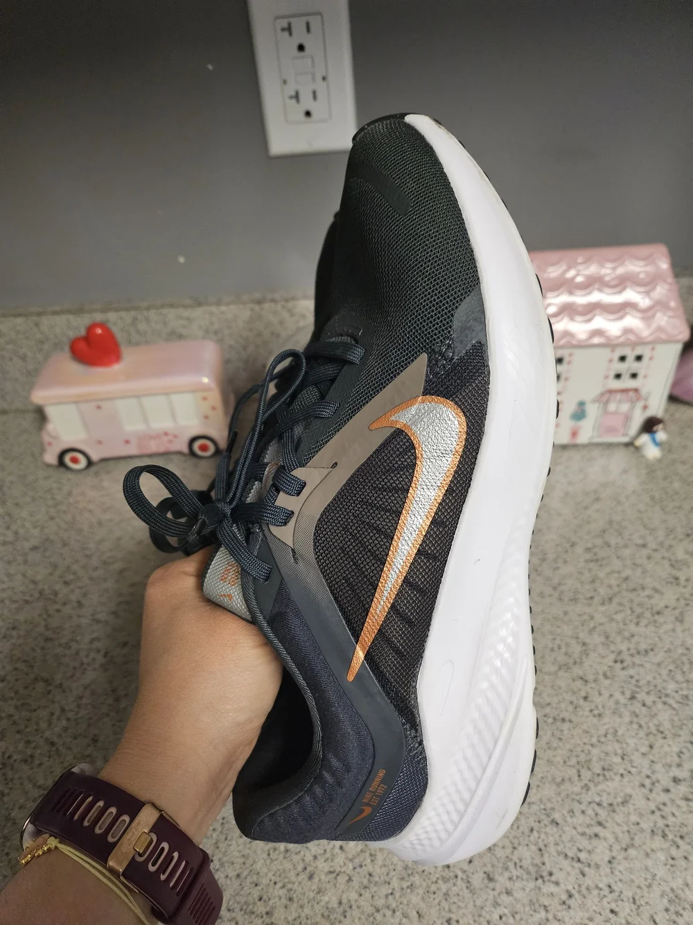Nike Women's Black Running Shoes with Metallic Orange Swoosh